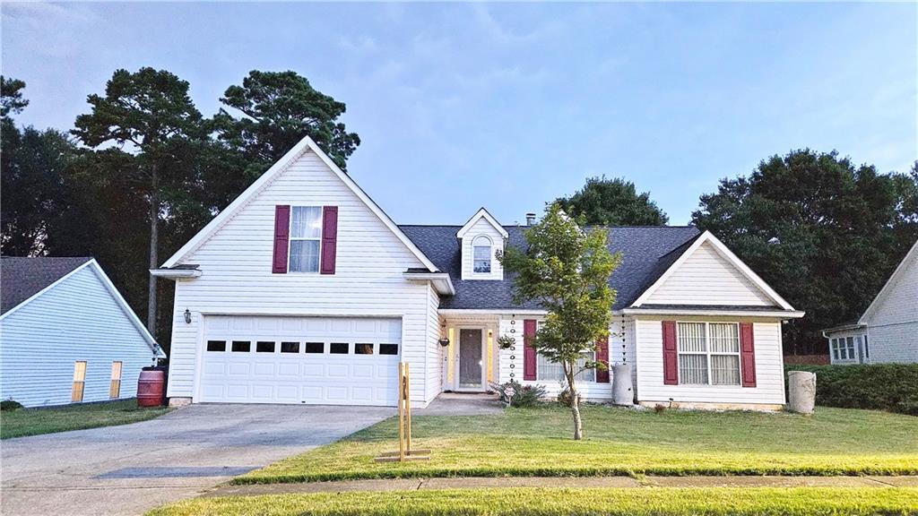 2233 Hansford Pass Buford, GA 30519 - Photo 1 of 45 a view of a house with a yard and potted plants