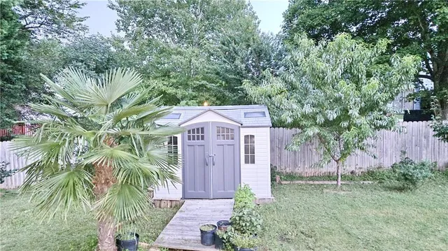 a view of a back yard of the house