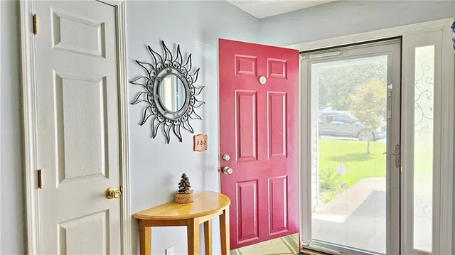 a view of a bath room with a window