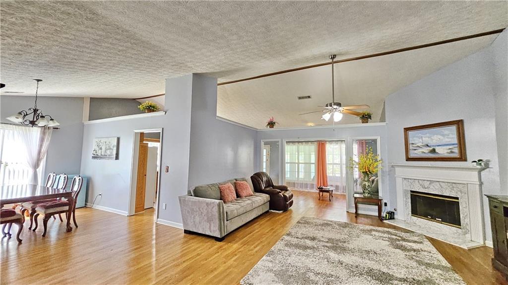 2233 Hansford Pass Buford, GA 30519 - Photo 17 of 45 a living room with furniture fireplace and window