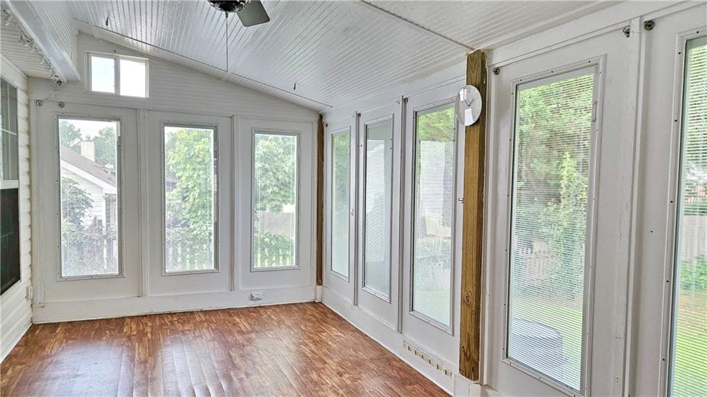 2233 Hansford Pass Buford, GA 30519 - Photo 27 of 45 a view of an entrance with wooden floor and windows