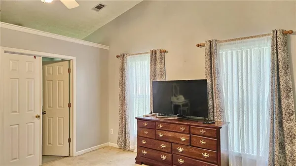 a room with furniture and flat screen tv