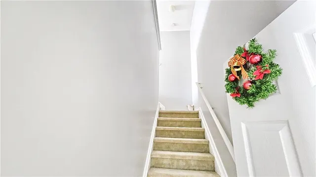 a vase of flowers sitting on a floor