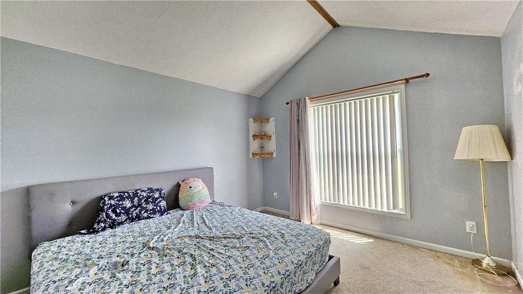 2233 Hansford Pass Buford, GA 30519 - Photo 44 of 45 a bedroom with a bed and a window