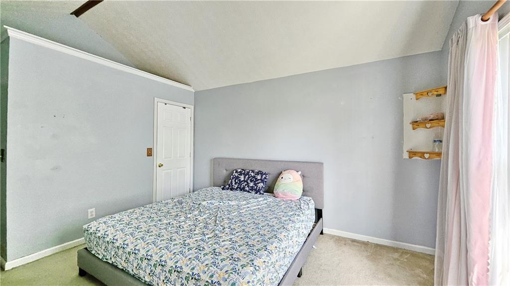 2233 Hansford Pass Buford, GA 30519 - Photo 45 of 45 a bedroom with a bed and wooden floor