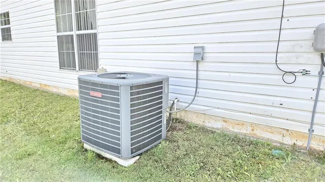a view of a bathtub in back yard of the house