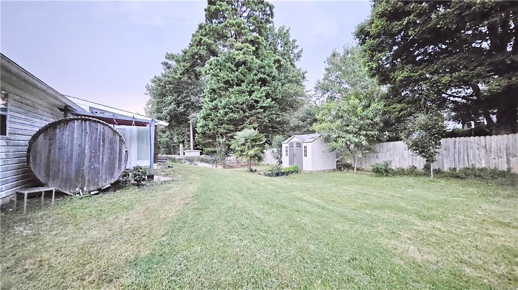 2233 Hansford Pass Buford, GA 30519 - Photo 10 of 45 a backyard of a house with a yard and outdoor seating