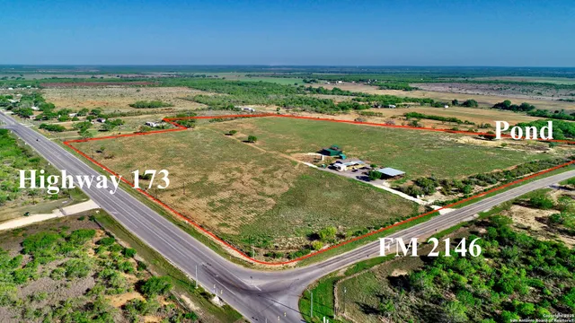 an aerial view of house with yard