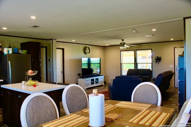 a kitchen with a refrigerator a stove a sink and a microwave