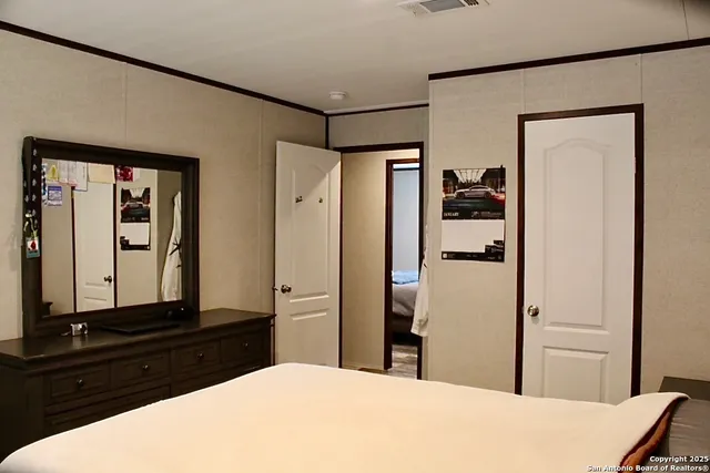 a kitchen with a refrigerator and a stove top oven