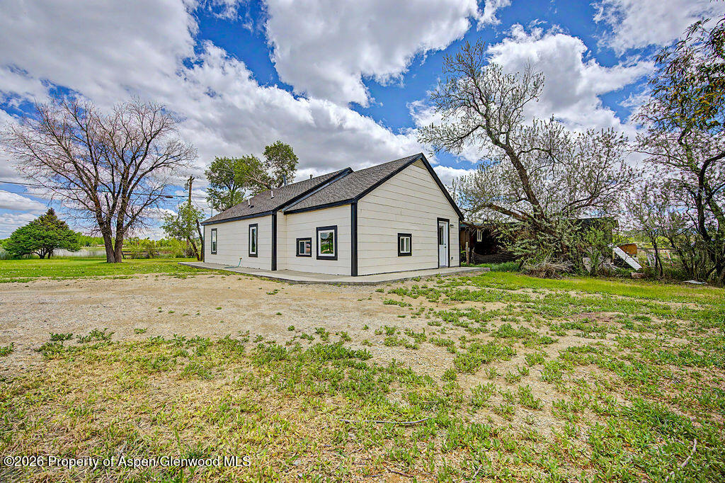 54 South Ranney Street Craig, CO 81625 - Photo 25 of 32 a view of a house with a yard