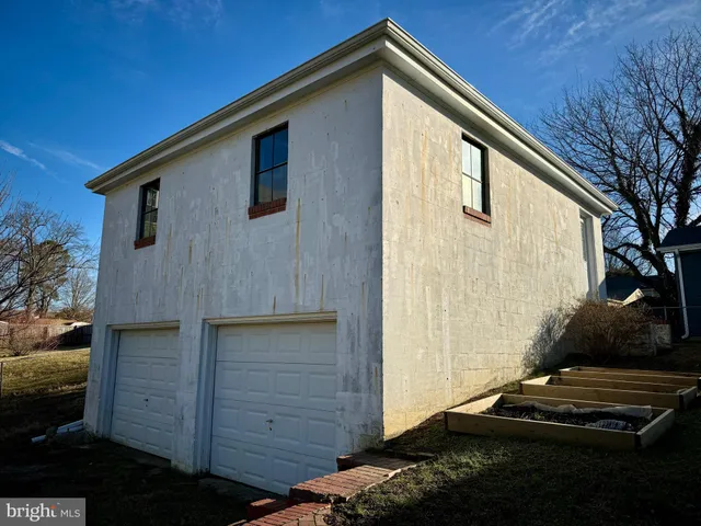 a kitchen with a refrigerator and a sink