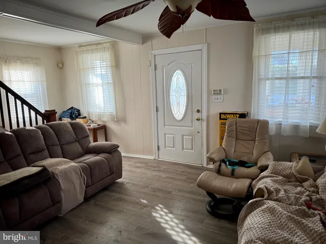 a view of yard with tree in front of it