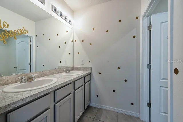 a white toilet sitting next to a bath tub
