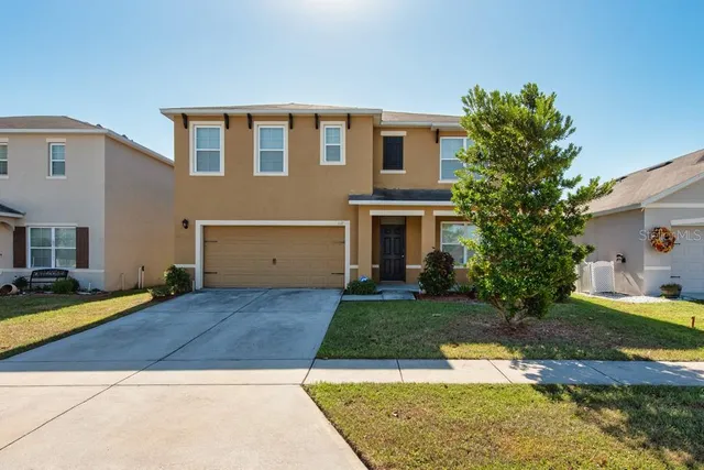 an aerial view of a building with a garden