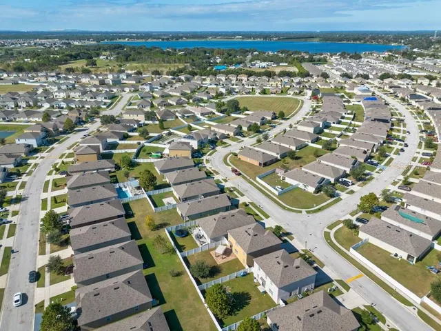an aerial view of a house with a swimming pool