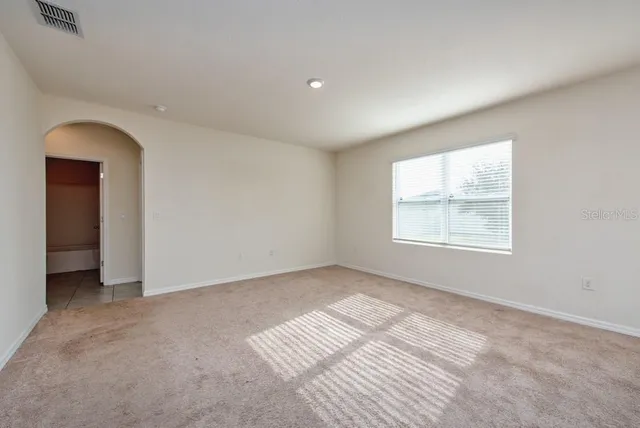 an empty room with windows