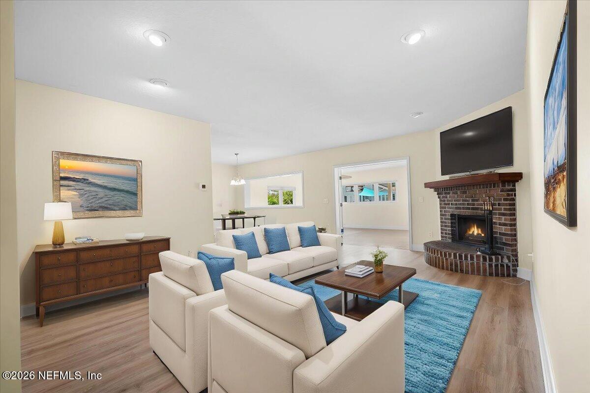 4201 San Pablo Road South Jacksonville, FL 32250 - Photo 12 of 50 a living room with fireplace furniture and a flat screen tv