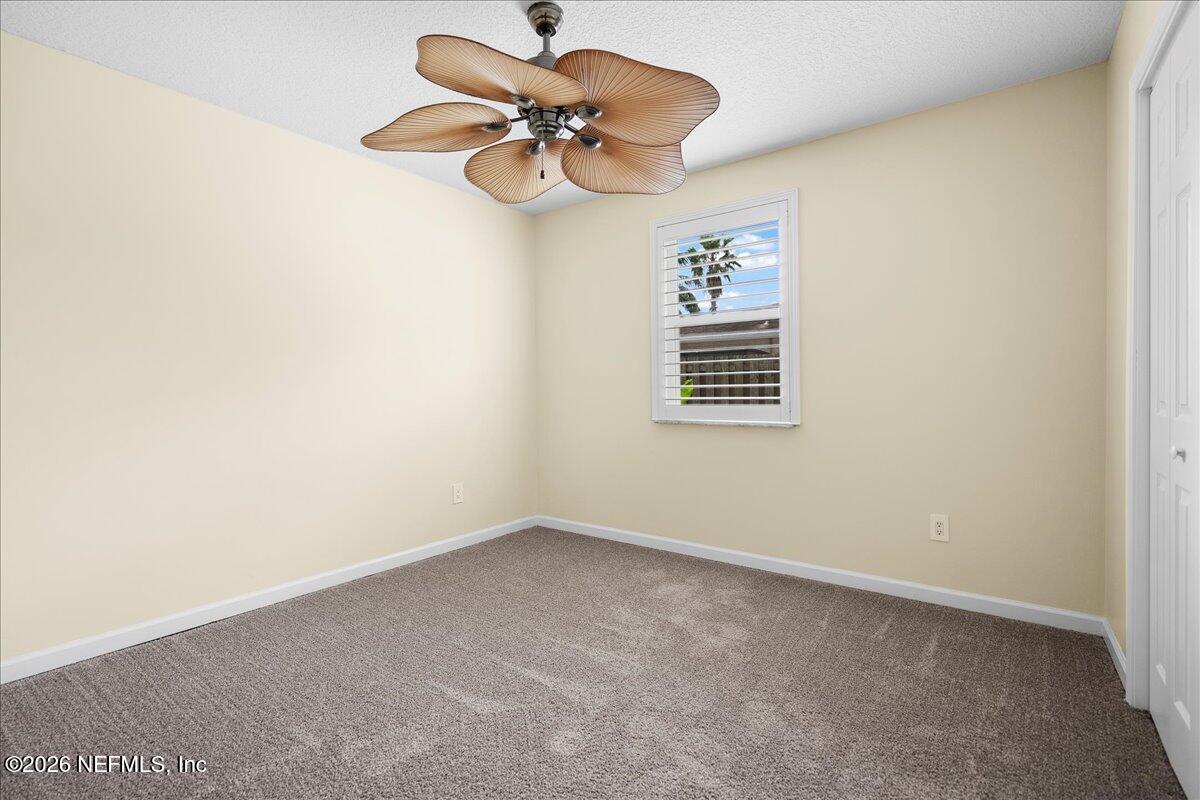 4201 San Pablo Road South Jacksonville, FL 32250 - Photo 18 of 50 a view of a small space with a fan