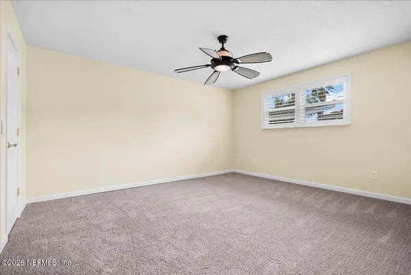 a view of a big room with carpet