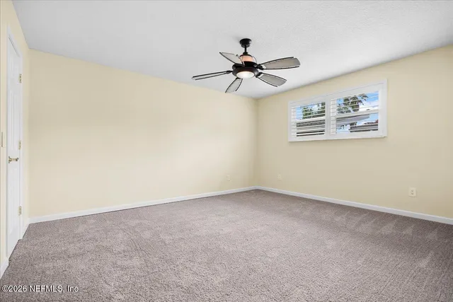 a view of a big room with carpet