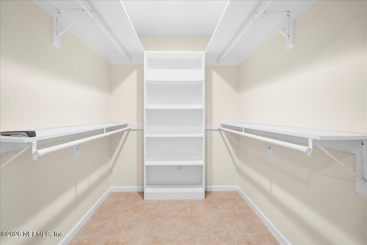 4201 San Pablo Road South Jacksonville, FL 32250 - Photo 25 of 50 a view of walk in closet with empty racks