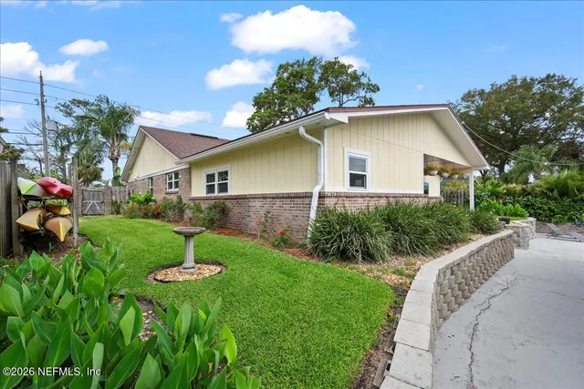 a house view with a garden space