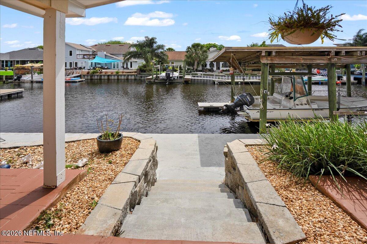 4201 San Pablo Road South Jacksonville, FL 32250 - Photo 33 of 50 a view of a lake with couches chairs