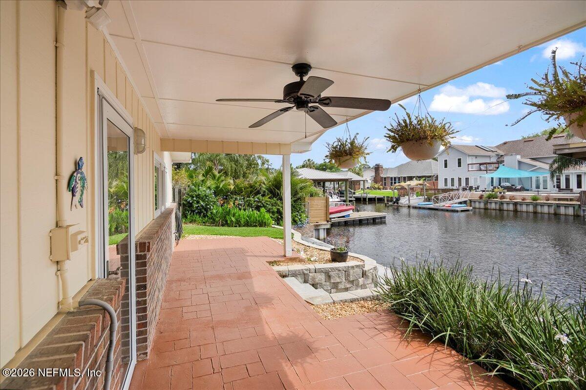 4201 San Pablo Road South Jacksonville, FL 32250 - Photo 34 of 50 a view of a patio with a table chairs and a table