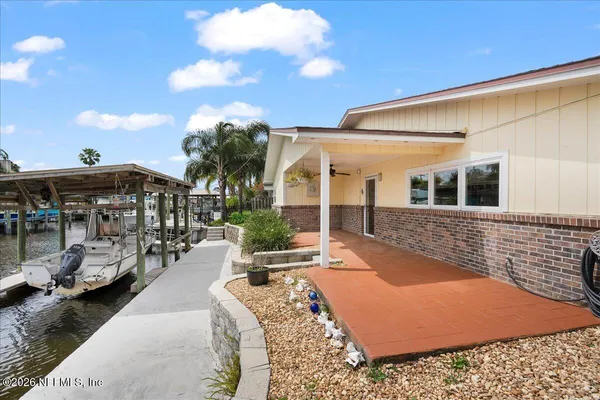 a view of a building with cars