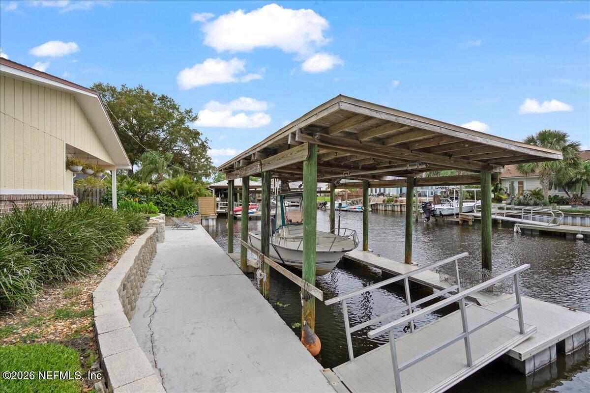 4201 San Pablo Road South Jacksonville, FL 32250 - Photo 39 of 50 a view of a house with pool and sitting area