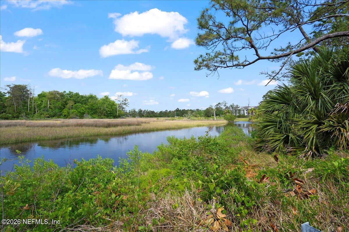 4201 San Pablo Road South Jacksonville, FL 32250 - Photo 40 of 50 a view of a lake with houses in the back