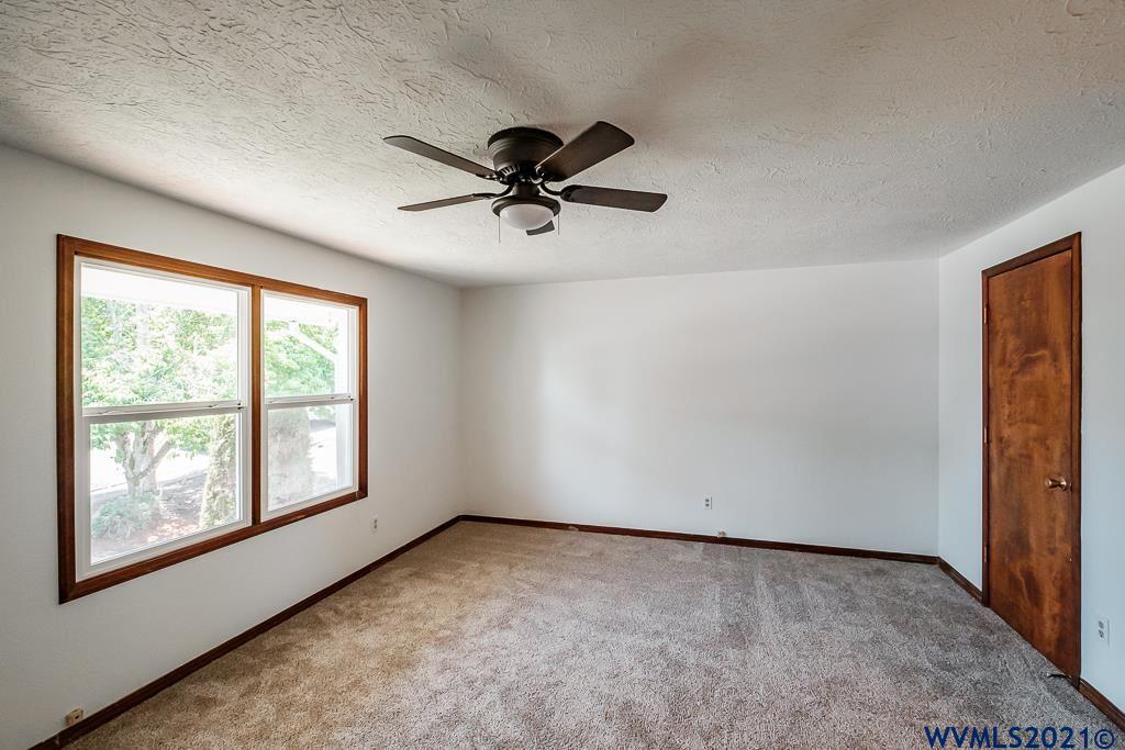 1278 Southwest Maple Street Dallas, OR 97338 - Photo 19 of 42 a view of a livingroom with a ceiling fan and window