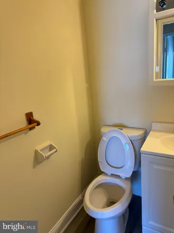 a bathroom with a toilet and a sink