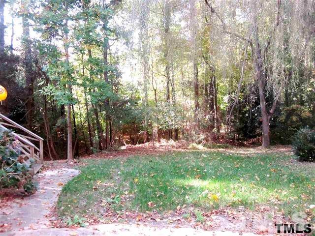 4901 Kinross Court Raleigh, NC 27613 - Photo 12 of 18 a view of a backyard with tree