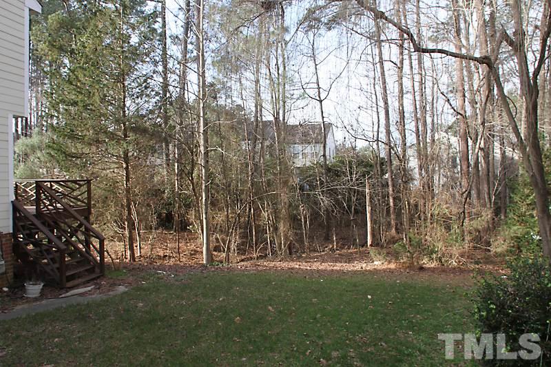 4901 Kinross Court Raleigh, NC 27613 - Photo 14 of 18 a view of outdoor space with a garden