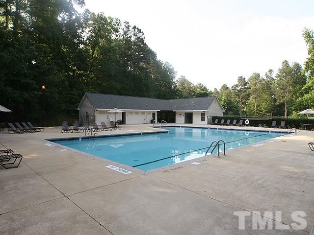 4901 Kinross Court Raleigh, NC 27613 - Photo 18 of 18 a front view of house with yard and car parked