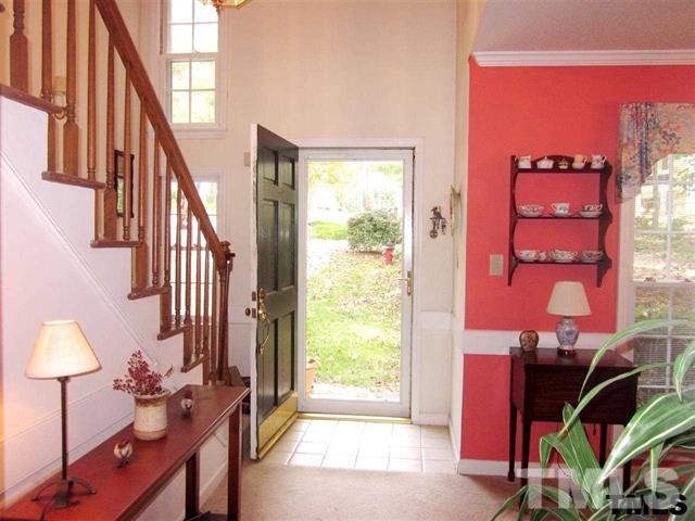 4901 Kinross Court Raleigh, NC 27613 - Photo 3 of 18 a view of a balcony with furniture and a potted plant