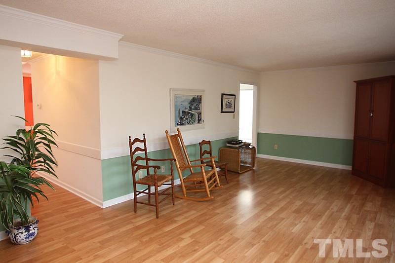 4901 Kinross Court Raleigh, NC 27613 - Photo 6 of 18 a view of a dining room with furniture and wooden floor