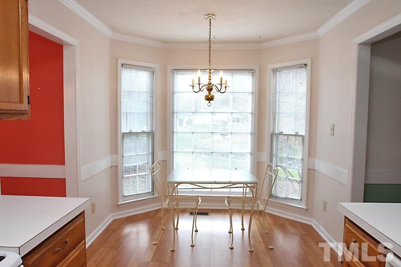 4901 Kinross Court Raleigh, NC 27613 - Photo 7 of 18 a view of a livingroom with wooden floor and a window