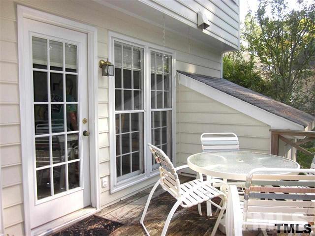 4901 Kinross Court Raleigh, NC 27613 - Photo 10 of 18 a balcony with table and chairs