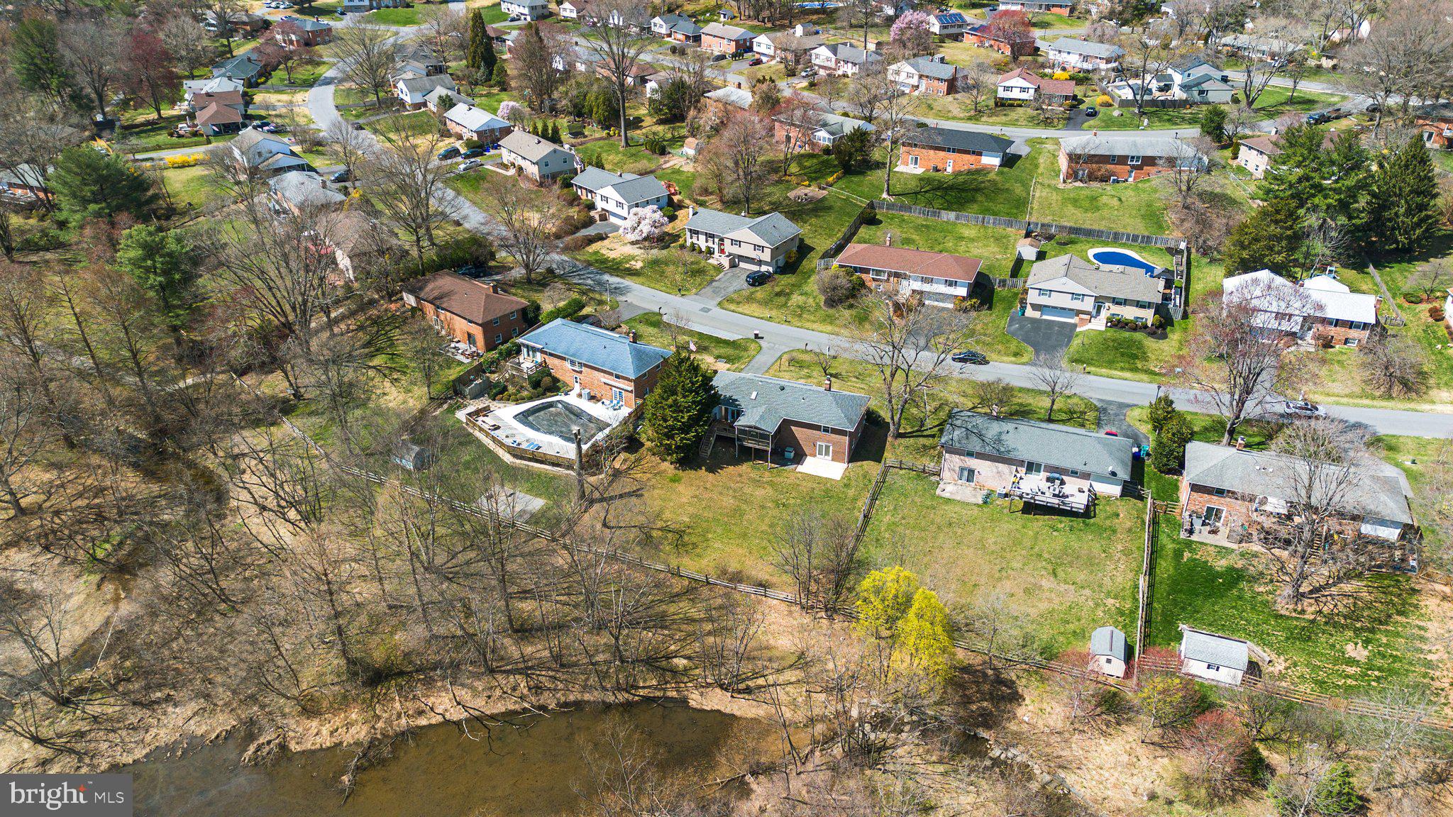 3428 Falling Green Road Olney, MD 20832 - Photo 54 of 64 an aerial view of residential houses with outdoor space and swimming pool