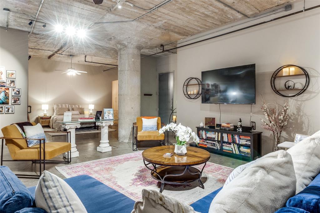 1122 Jackson Street, Unit 821 Dallas, TX 75202 - Photo 1 of 1 a living room with furniture and a large window