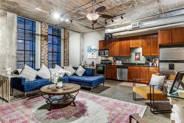 a living room with furniture and a fireplace