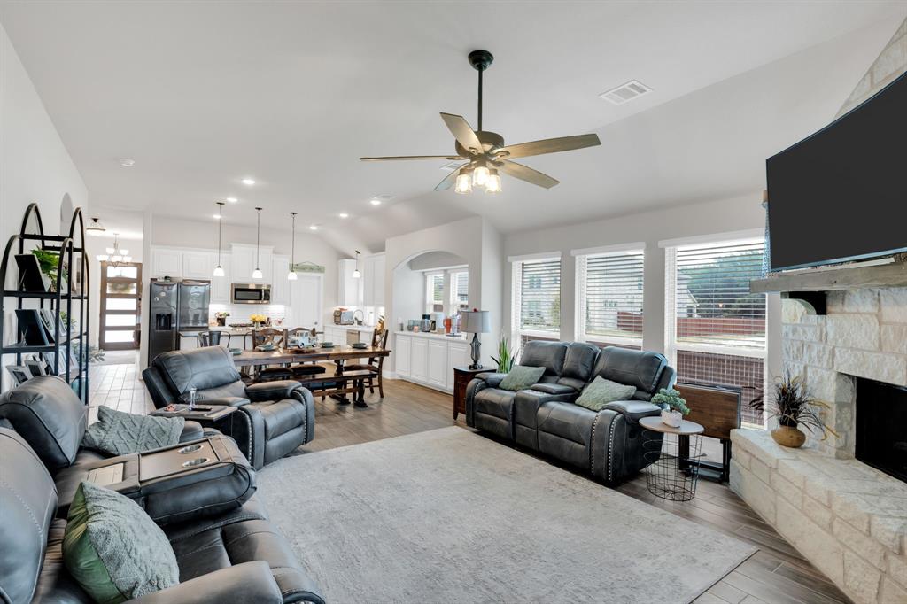 5038 Ridgehurst Lane Midlothian, TX 76065 - Photo 12 of 37 a living room with fireplace furniture and a flat screen tv
