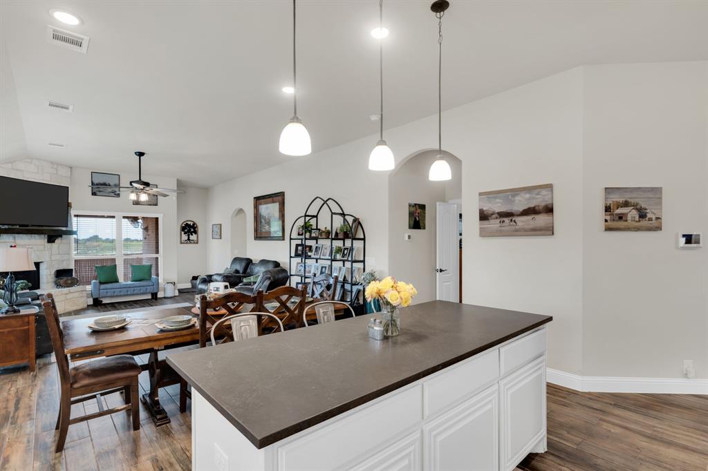 5038 Ridgehurst Lane Midlothian, TX 76065 - Photo 37 of 37 a view of a dining room and livingroom with furniture wooden floor a chandelier