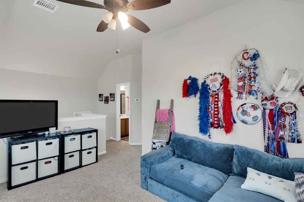 5038 Ridgehurst Lane Midlothian, TX 76065 - Photo 19 of 37 a living room with furniture and a flat screen tv