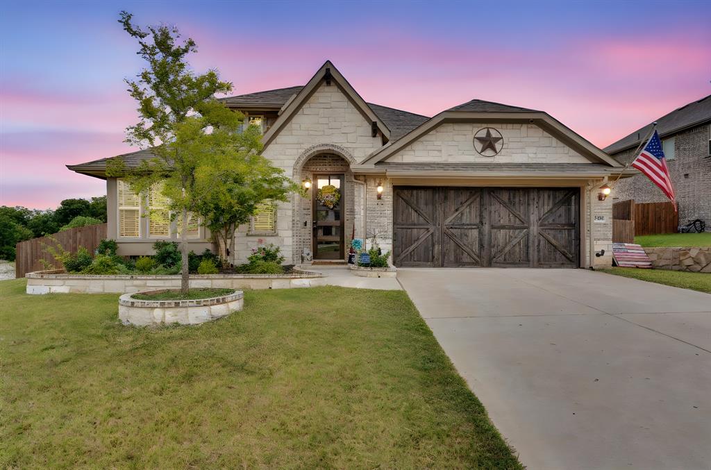 5038 Ridgehurst Lane Midlothian, TX 76065 - Photo 2 of 37 a front view of a house with a garden and plants