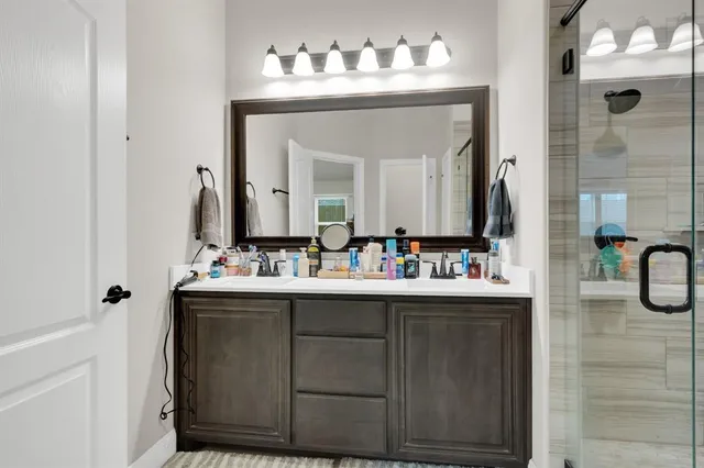 a bedroom with furniture and a flat screen tv