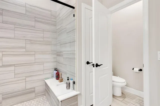 a bathroom with a sink vanity and mirror